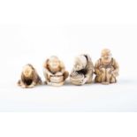Four Japanese carved ivory netsukes, Meiji period, comprising a figure of a man hunched over a