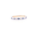 An 18ct yellow gold, diamond, and sapphire half eternity band ring, set with alternating round-cut