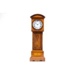 A late 19th century miniature rosewood and inlaid satinwood longcase clock, the enamel dial