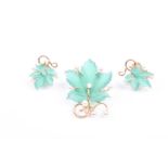 A yellow metal, diamonds, pearl, and green hardstone brooch, in the form of a carved maple leaf,