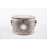 Regency electroplated biscuit barrel, oval form, the flush-hinged cover opens to reveal a divider,