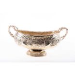 A large silver plated twin handled bowl, 20th century, of oval form, the rim with relief cast