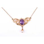 A 9ct yellow gold, amethyst, and pearl pendant in the Art Nouveau style, the openwork mount set with