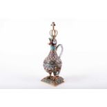 A Russian style silver, parcel gilt and champleve enamel wine decanter in the form of a cockerel,