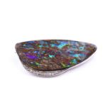 A diamond and boulder opal brooch, set with an elongated boulder opal, the white metal mount set