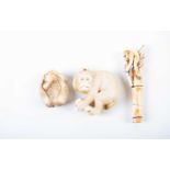 Three Japanese carved ivory netsuke, Meiji/Taisho period, comprising a large ape, bending over
