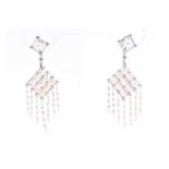 A pair of diamond and pearl drop earrings, the diamond-shaped mount thread-set with nine pearls,