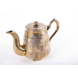 A Russian 19th century silver gilt bachelor teapot; Russian silver marks, dated 1875; the flared
