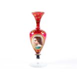 A 19th century Bohemian ruby and clear glass pedestal spill vase, with a hand painted portrait to