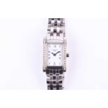 A Longines ladies stainless steel wristwatch, the rectangular white dial with baton indices, in a