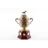 A late Victorian silver gilt equestrain trophy cup and cover. London 1901 by Rowlands and Frazer.