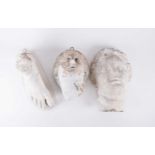 A group of three decorative plaster casts, two of classical female heads with another of a