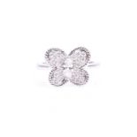 A platinum and diamond butterfly ring, set with a marquise-cut diamond of approximately 0.20 carats,