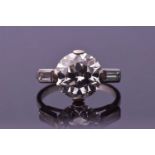 An impressive round brilliant-cut solitaire diamond ring, the central diamond of approximately 4.