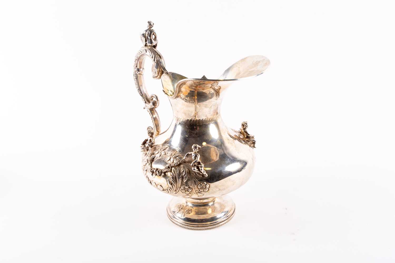 A Continental silver water pitcher, impressed marks, 20th Century, baluster form, acanthus-leaf