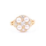 An 18ct yellow gold, diamond, and pearl cluster ring, of circular design, set with four pearls and