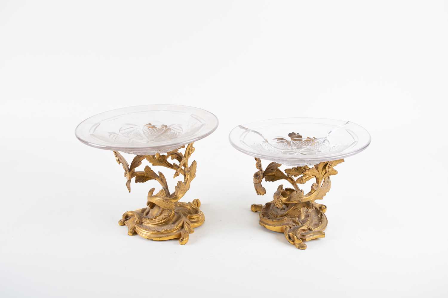 A pair of French 19th century ormolu tazzas, the bases of stylised branch form together with two