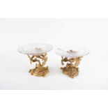 A pair of French 19th century ormolu tazzas, the bases of stylised branch form together with two