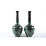 A pair of WMF Arts & Crafts copper vases, the green enamel ground decorated with stylised flowers,