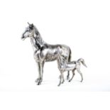 A large 20th century silver plated model of a horse, 28 cm x 33 cm, together with another smaller.