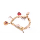 An 18ct yellow gold curb-link charm bracelet, with smooth and decorated links, suspended with