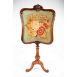 A fine Victorian mahogany pole screen, with glazed shield-shape panel containing an embroidered