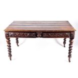 A Victorian carved oak dining table in the 17th century style, rectangular top with carved frieze