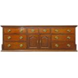 A George III oak dresser base, the rectangular top above six long and two short drawers with