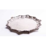 A Irish silver salver,Dublin 1915 by West & Son, with piecrust edge on three scroll feet, 33 cm