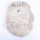 A nineteenth-century or earlier white marble wall plaque, depicting a coat of arms or shop sign (