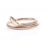 A 9ct yellow gold covered snake bracelet, the head with engraved decoration inset with round-cut