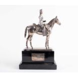 A George V silver presentation statue of a cavalry officer on horseback, London 1914 by Garrard &