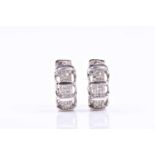 A pair of 14ct white gold and diamond half hoop earrings, pave-set with mixed-cut diamonds, of