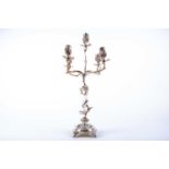 An Italian silver five-light candelabrum, stamped 800, five leaf-capped scroll arms each