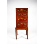 A small George III mahogany chest on stand, the plain caddy top with moulded rim, over four