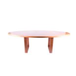 A large teak oval centre table, circa 1950s, on rectangular supports, 245 cm x 89 cm x 76 cm high.