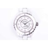 A Chanel 'J12' white ceramic and diamond mounted wrist watch, the white dial set with diamond hour
