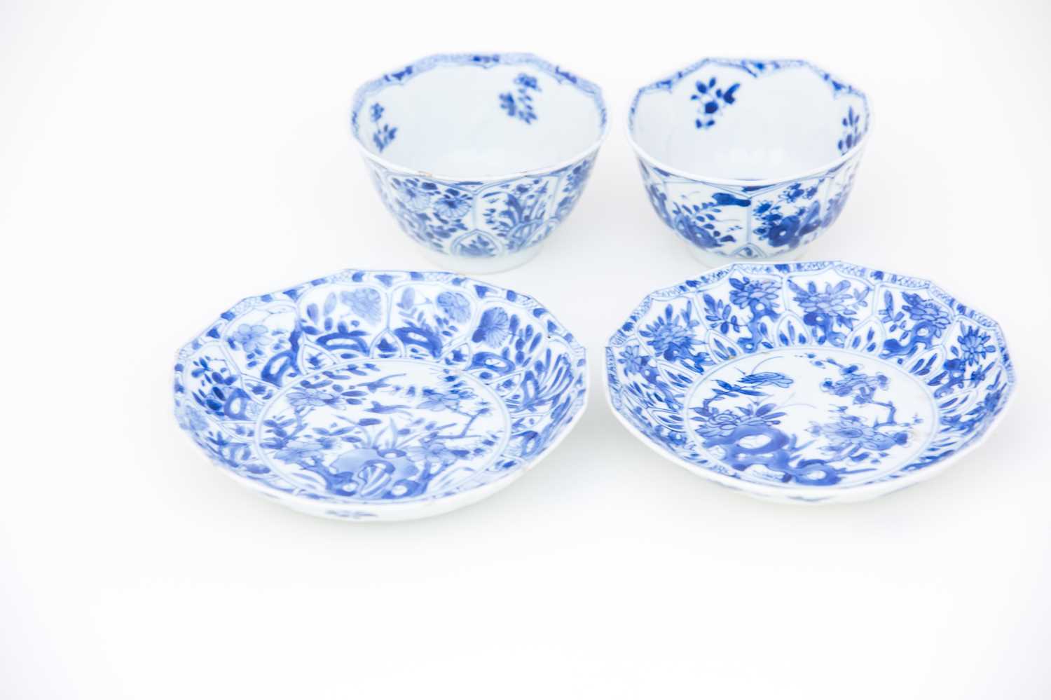 A near pair of Chinese blue & white petal moulded tea bowls and matched saucers, Kangxi (1662 -
