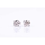 A pair of solitaire diamond earrings, set with round brilliant-cut diamonds of approximately 1.50