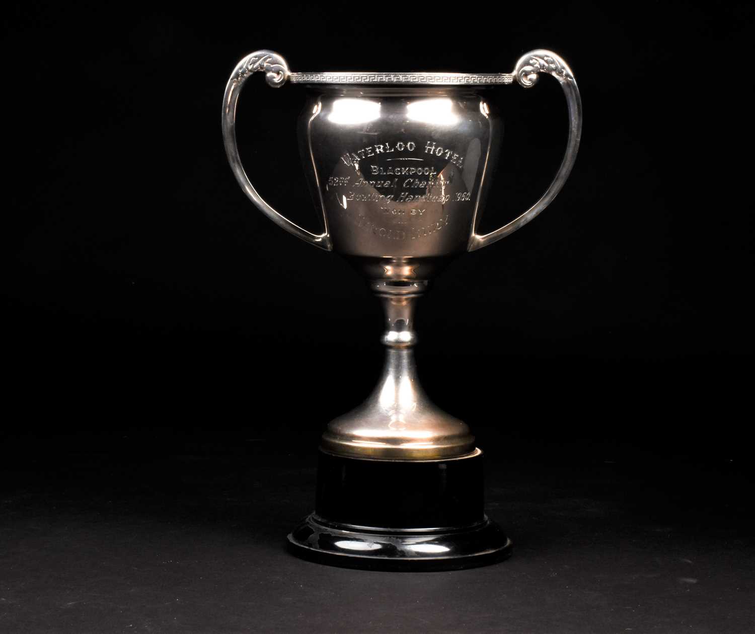 A George V large silver trophy, Birmingham 1932 by Davies & Powers, mounted to an ebonised base,