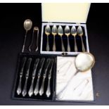 A Continental silver salad spoon with gilt bowl, together a cased set of silver grapefruit spoons, a