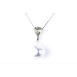 A peridot and pearl pendant, set with a pear-cut peridot above a naturalistic pearl with greenish-