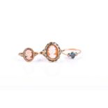 A shell cameo set ring, in 9ct gold mount, another smaller and a three stone ring in 9ct gold mount,
