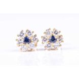 A pair of sapphire and diamond cluster earrings, the circular cut sapphires claw set within a