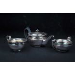 A George V three-piece silver teaset, Sheffield 1924 by James Dixon & Sons, comprising a teapot,