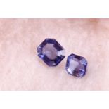 Two loose iolite gemstones of approximatey 5.0 carats combined, together with a yellow gemstone (