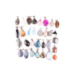 Thirty hardstone pendants in white metal mounts, including two polished turquoise pendants in