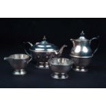 A George V silver four-piece tea set, Birmingham 1931 by Dennison, comprising a teapot, hot water