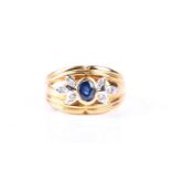 A sapphire and diamond ring, the oval cut sapphire in rub over mount with three stone diamond