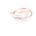 A Tiffany interlocking circles ring, the rose gold band signed and marked ;'750', the silver band